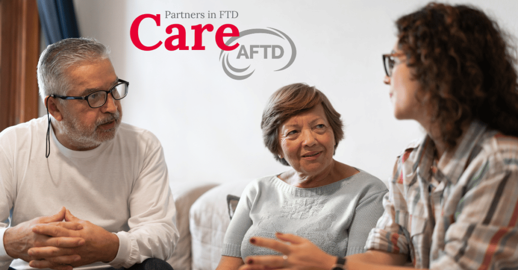 Husband and wife talking to community care worker