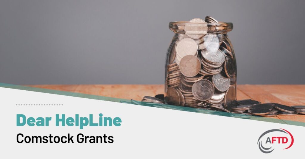 Graphic Text: Dear HelpLine - Comstock Grants | Background: A jar of assorted change overflows onto a table